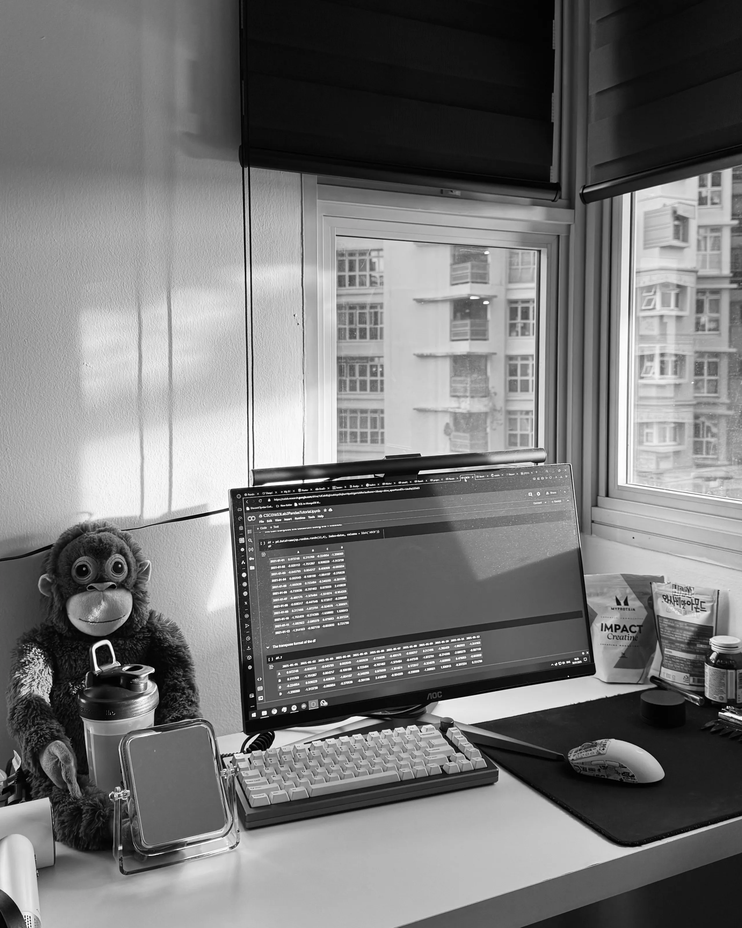 A desk setup with a monitor of code